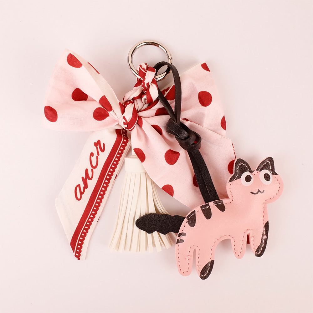 Pink tassels and bow on a decorative handbag accessory