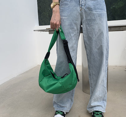 Crescent-shaped chest bag for hands-free weekend activities