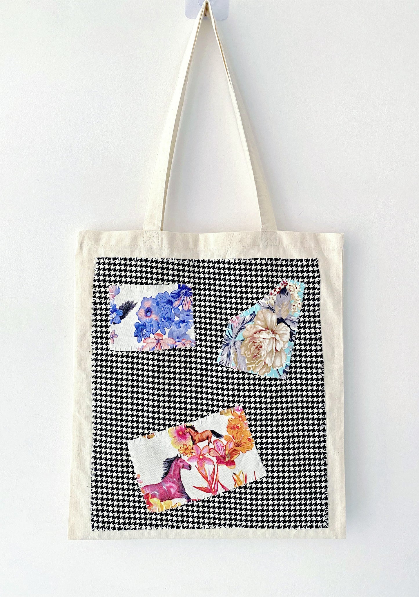 Durable large tote bag in natural canvas, featuring a unique patchwork panel for casual outfits and thoughtful gift ideas.