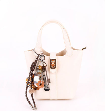 Small handmade bag charm with earthy natural materials
