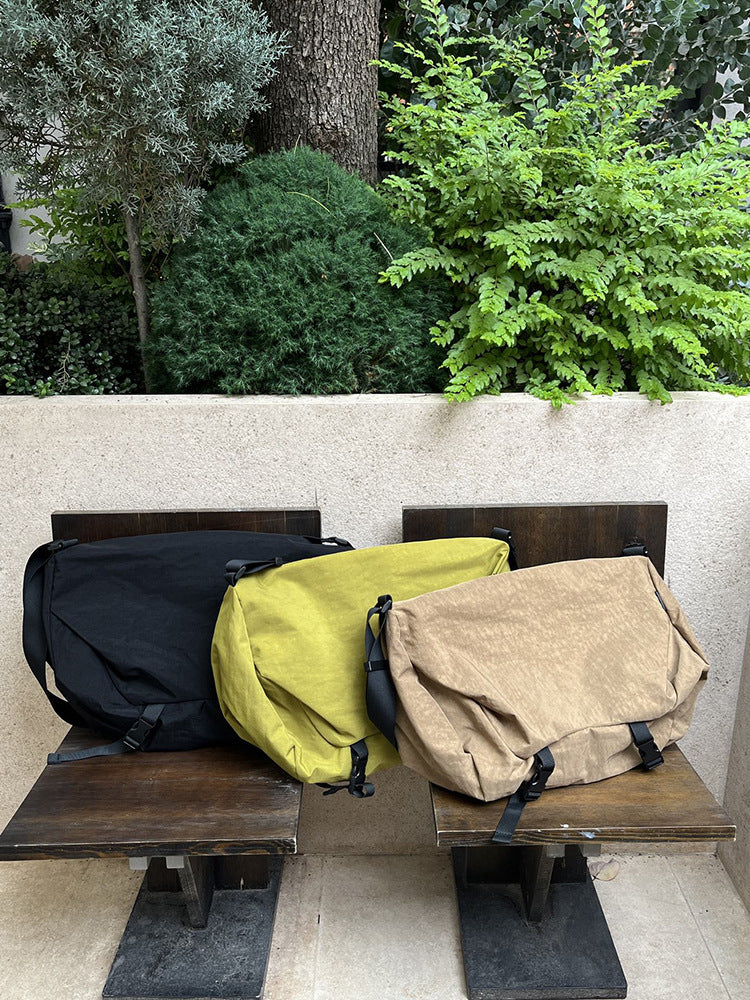 Large crossbody bag for carrying travel necessities