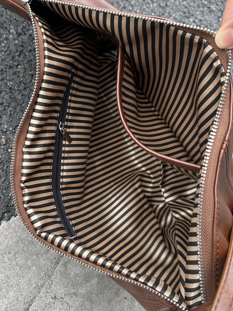 Sling shoulder bag for carrying phone and essentials