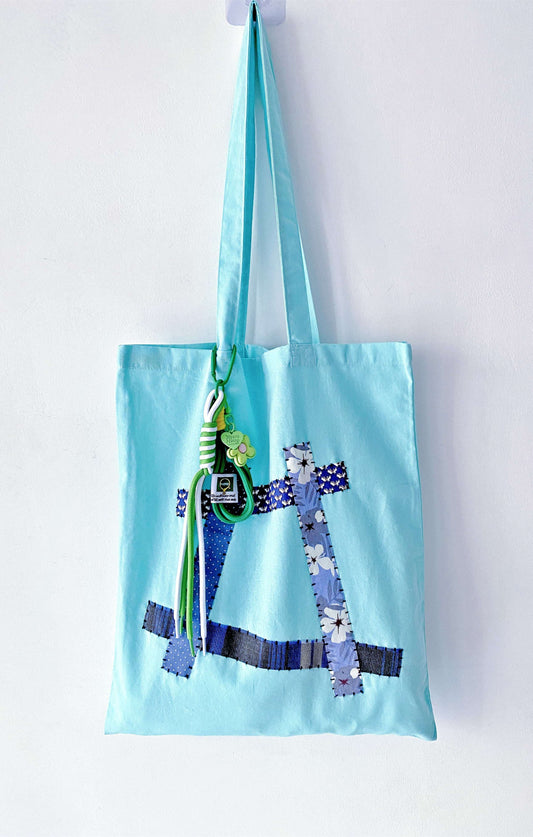 relaxed fabric tote lying flat with natural folds and creases