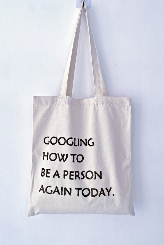 soft slouchy canvas tote bag with unique hand-drawn words, casual street style