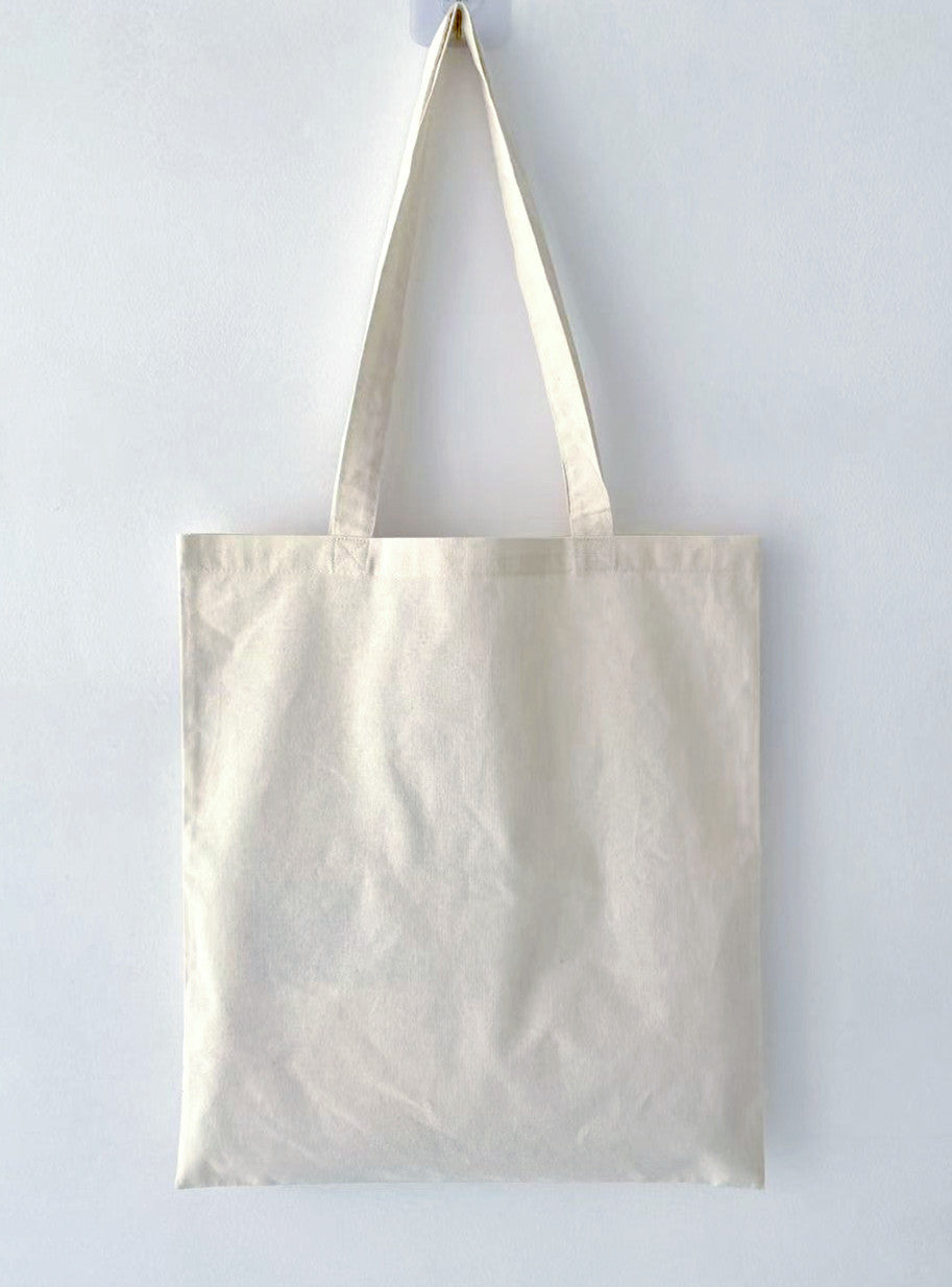 Ethical fashion statement: a durable tote replacing single-use plastic bags.