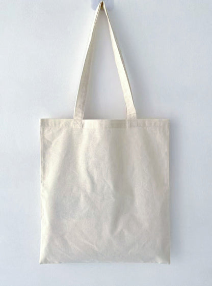 Ethical fashion statement: a durable tote replacing single-use plastic bags.