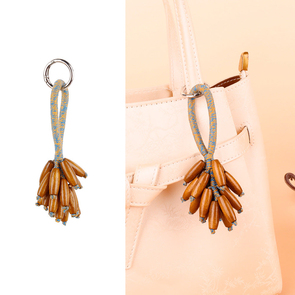 Small grape decoration photographed with a purse