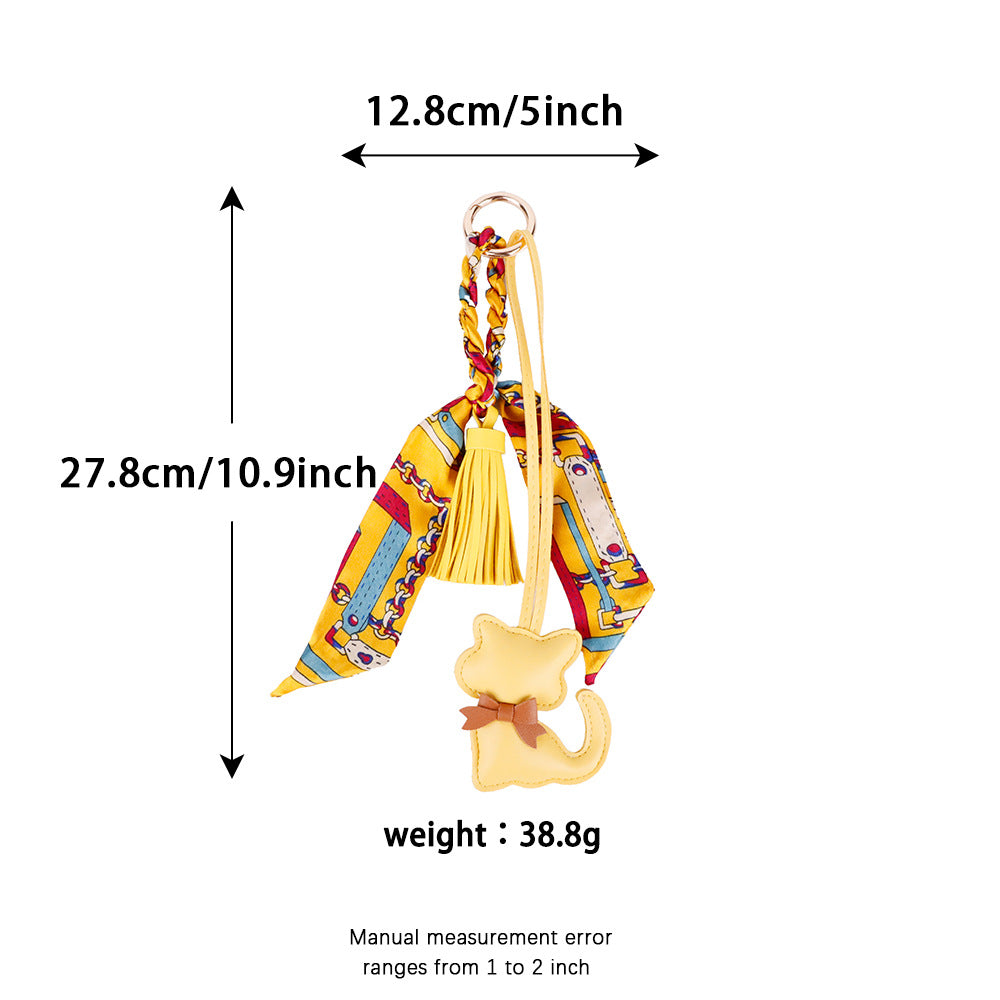 Cat bag decoration with colorful scarf detail