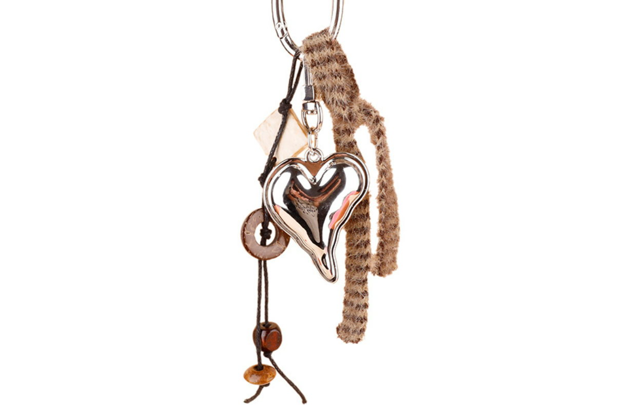 Small boho charm clipped onto a shoulder bag