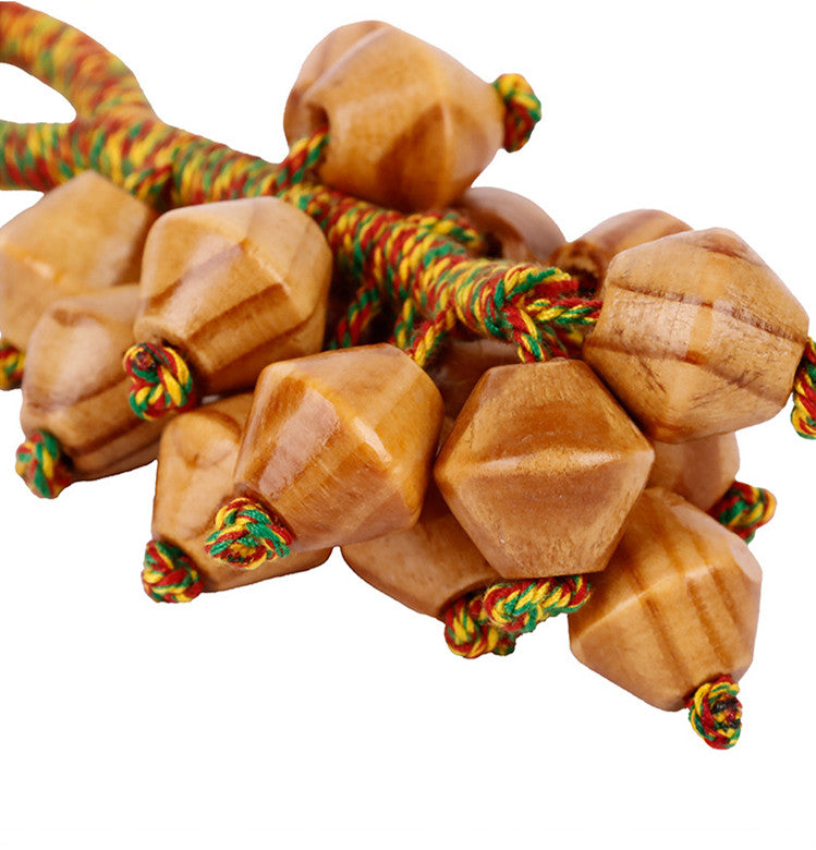 Textured fruit cluster hanging from a tote handle