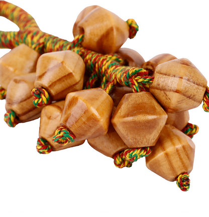 Textured fruit cluster hanging from a tote handle
