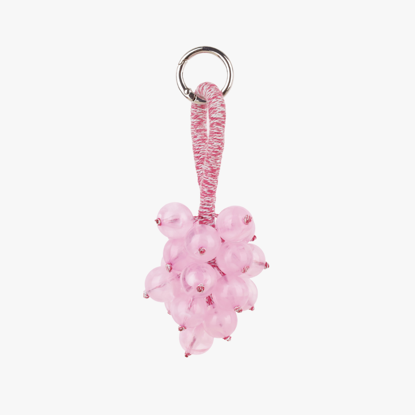 Textured fruit bunch decoration attached to a bag handle