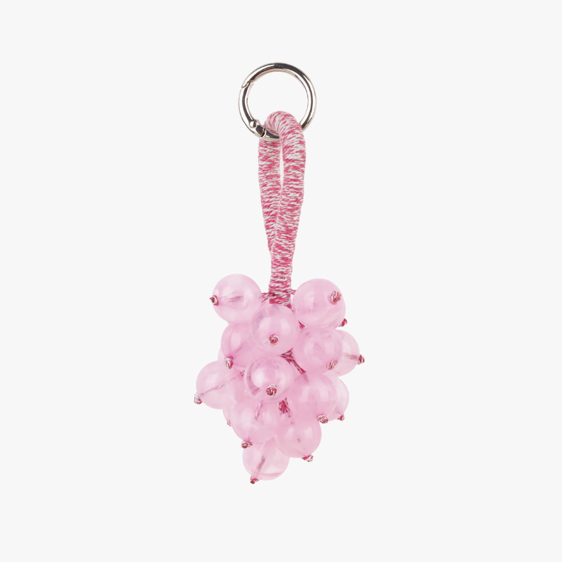 Textured fruit bunch decoration attached to a bag handle
