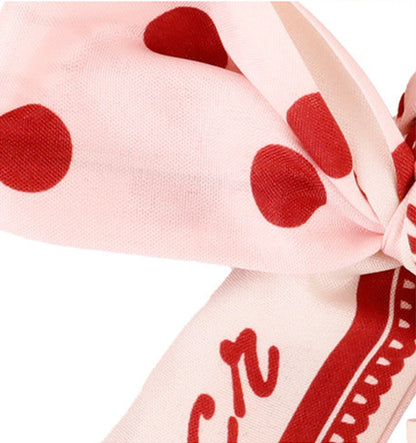 Handmade pink bag charm with a polka dot scarf design