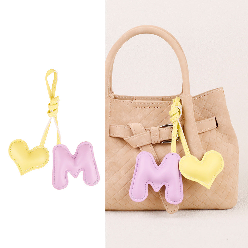 Handmade leather pendant for personalizing a handbag