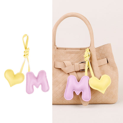 Handmade leather pendant for personalizing a handbag