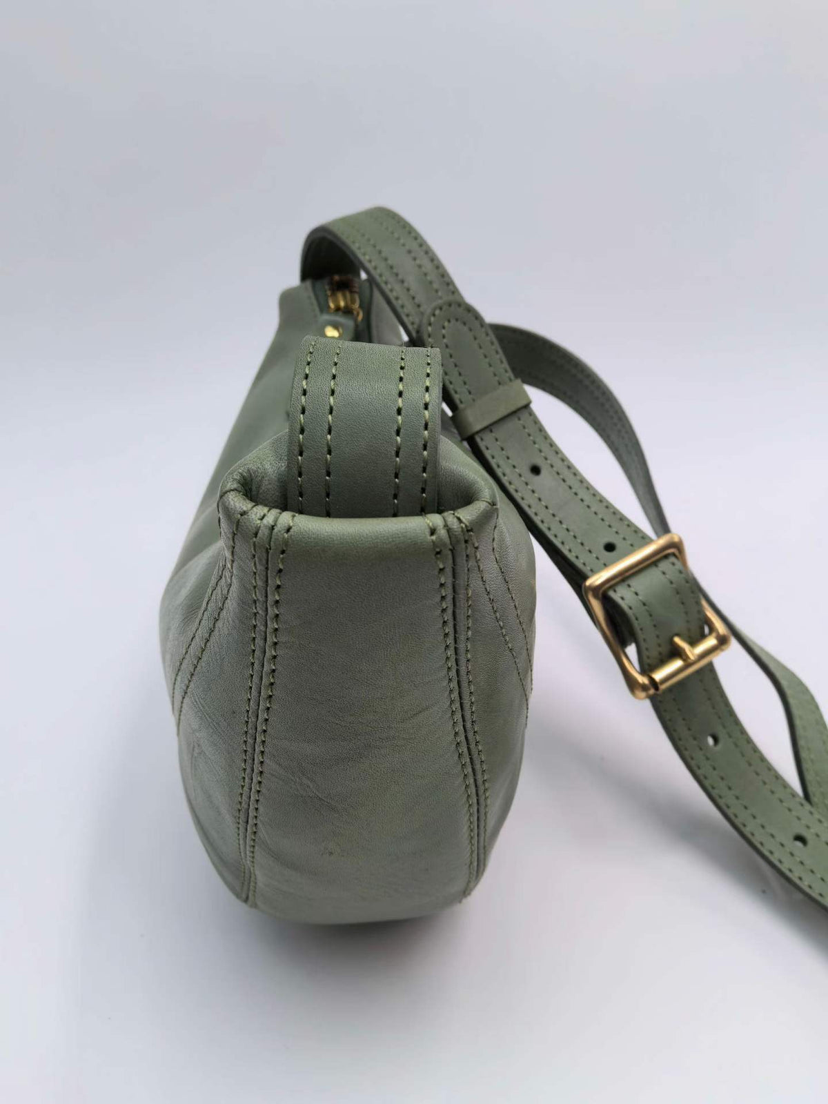 Minimal curved leather purse for simple everyday outfits