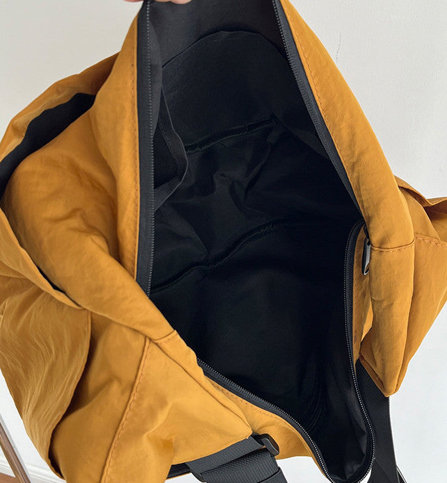 Functional half moon shoulder bag with smooth metal zipper closure
