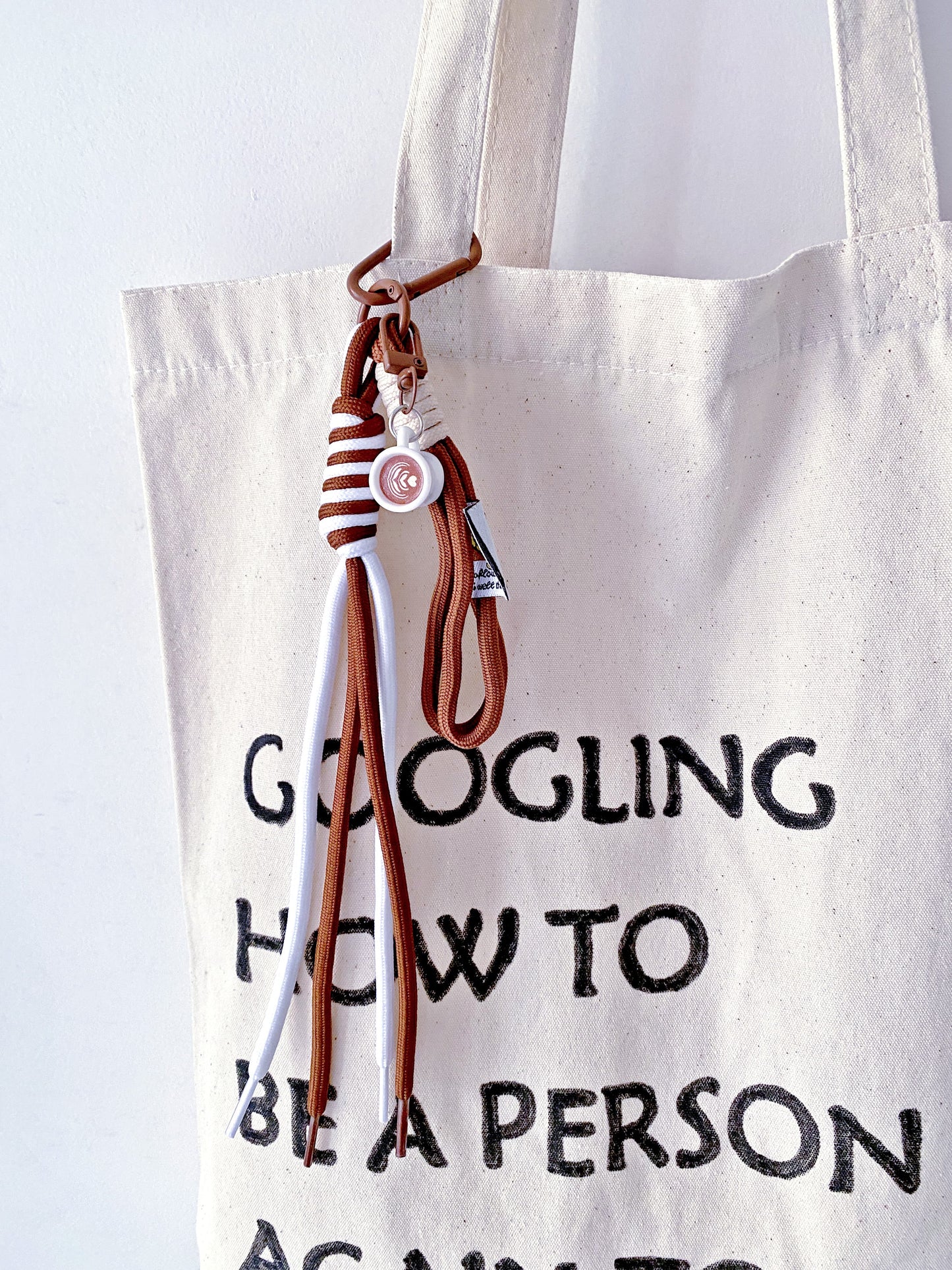 a soft canvas tote resting on a chair in a quiet morning room