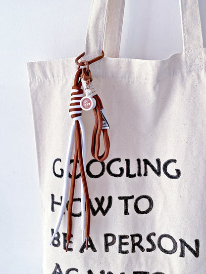 a soft canvas tote resting on a chair in a quiet morning room