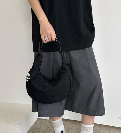 Women's half moon bag with a compact shape for daily errands