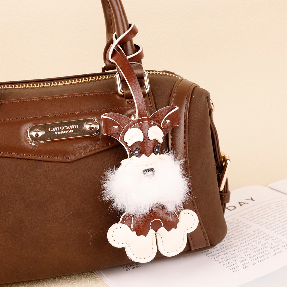Plush Schnauzer puppy key holder with a festive holiday style