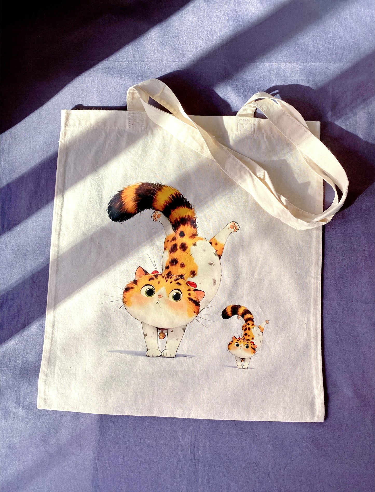 Looking for a unique gift? This soft cotton tote with a hand-printed orange cat is a fun, eco-conscious option for any occasion.