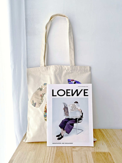 Spacious hand-stitched canvas tote for carrying arts and craft supplies