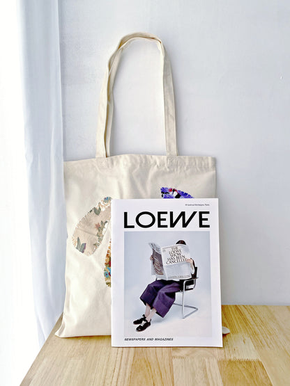 Spacious hand-stitched canvas tote for carrying arts and craft supplies