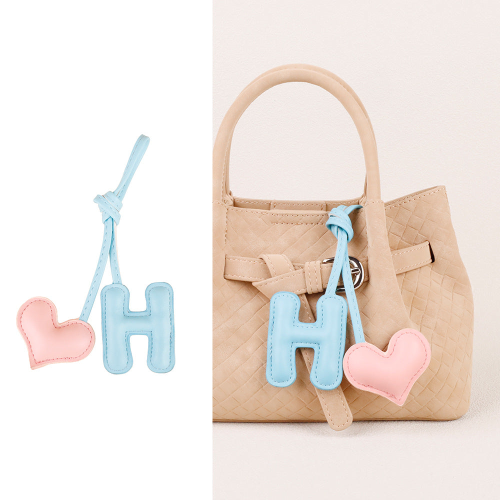 Letter heart decoration paired with a leather bag