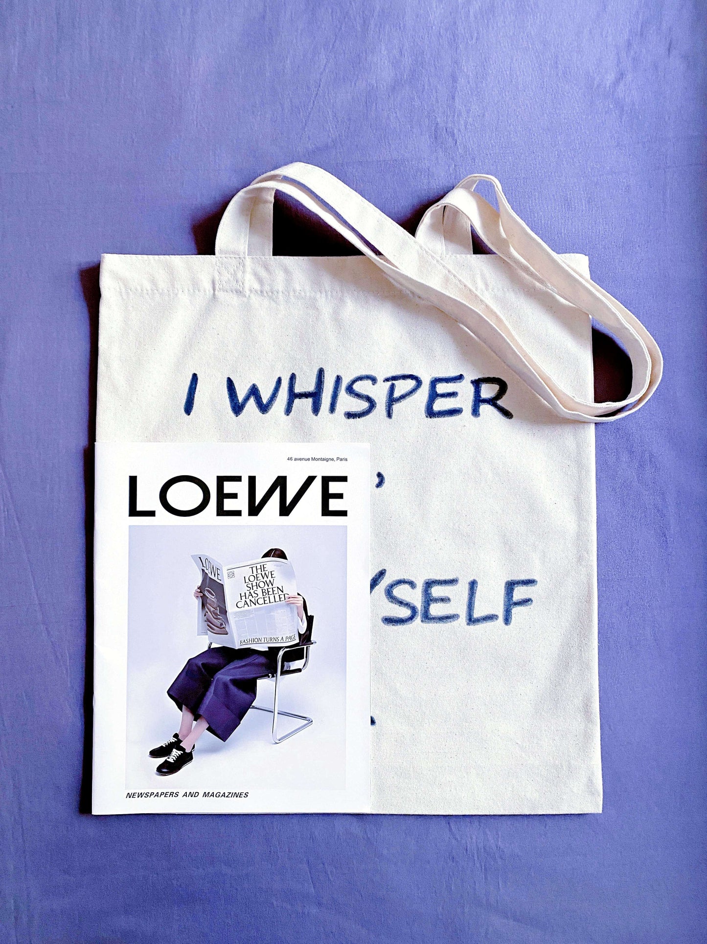 Durable library tote filled with hardcovers, appreciated by book club members for its strong straps and literary aesthetic