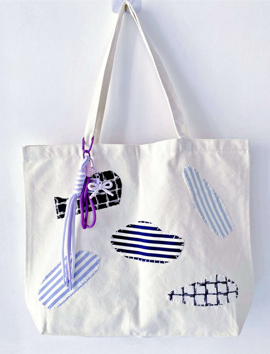 Versatile natural fiber tote styled with a neutral linen outfit for a breezy look.