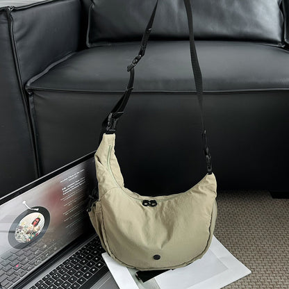 Crescent-shaped shoulder bag for casual weekend activities