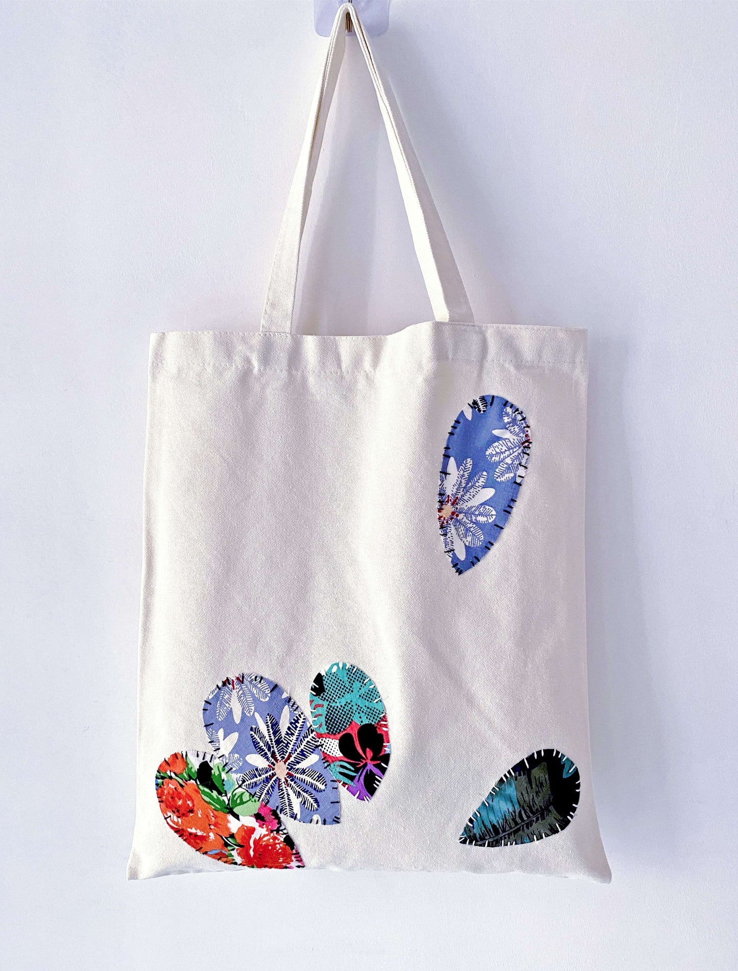 Artisan patchwork accents on a practical everyday bag that resists fast fashion trends.