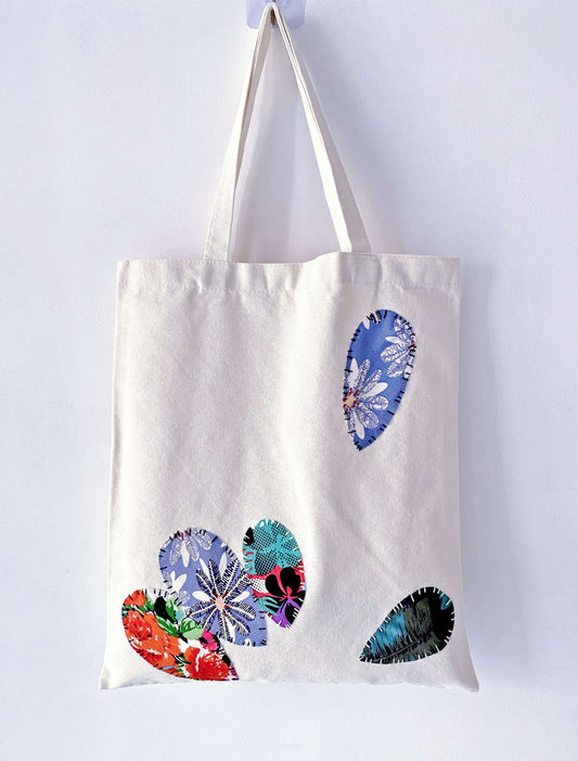 Artisan patchwork accents on a practical everyday bag that resists fast fashion trends.