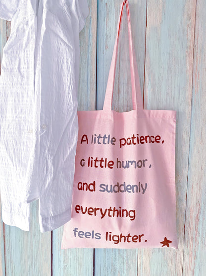 soft touch tote with original handwritten print in natural daylight
