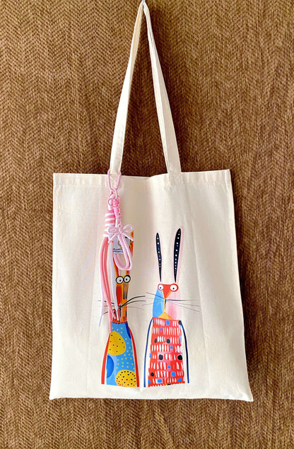 Soft cotton fabric bag draped over a shoulder with a visible thin texture.