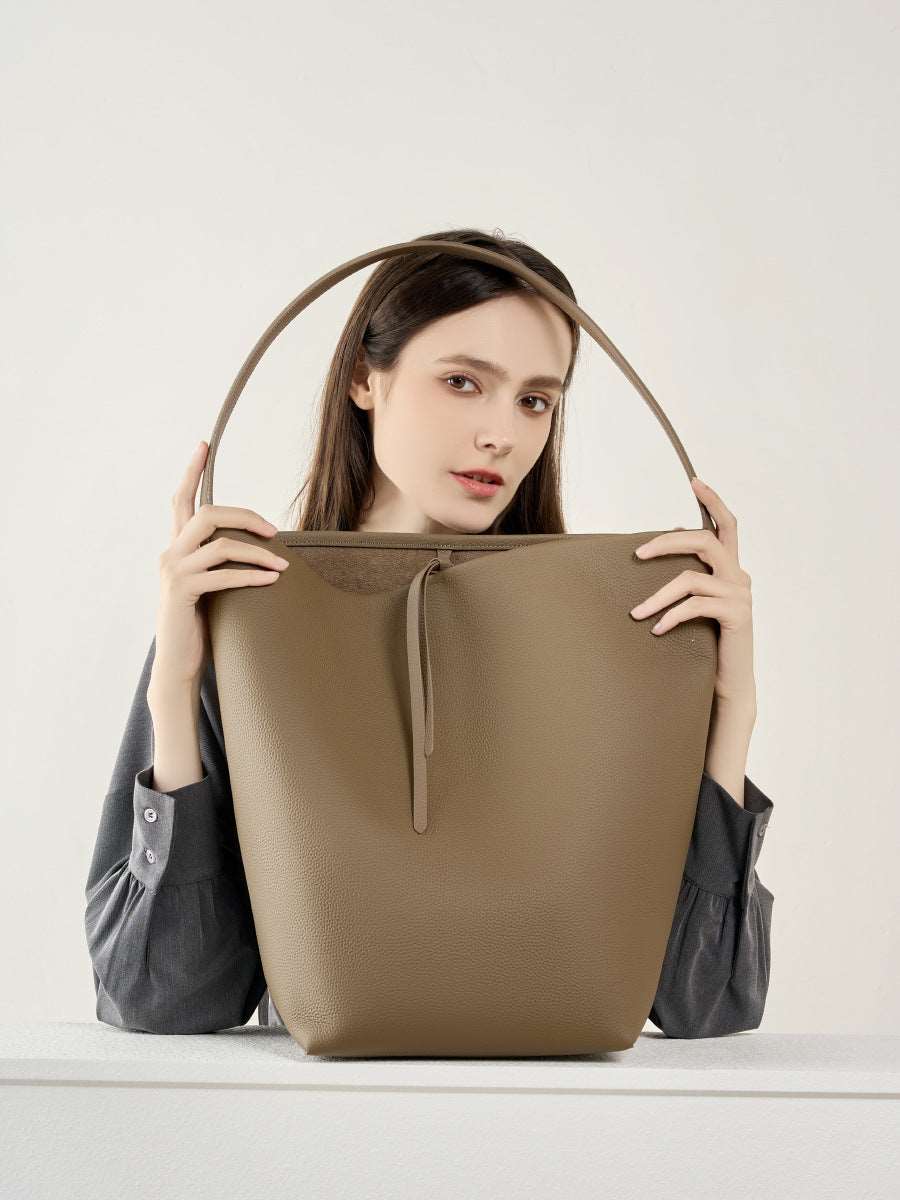 Elegant women's soft leather bucket bag, can be worn crossbody or over the shoulder