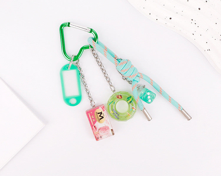 Handmade green charm attached to a canvas tote