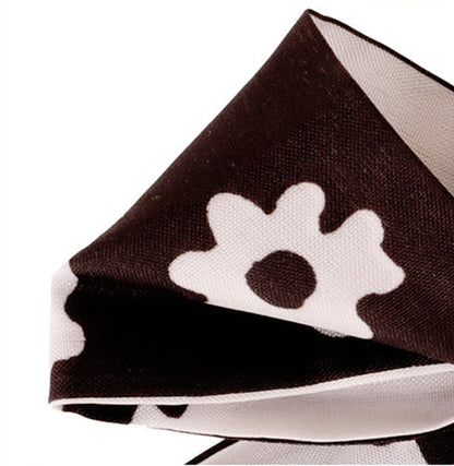 Black silk bow purse charm shown as a aesthetic holiday gift for her