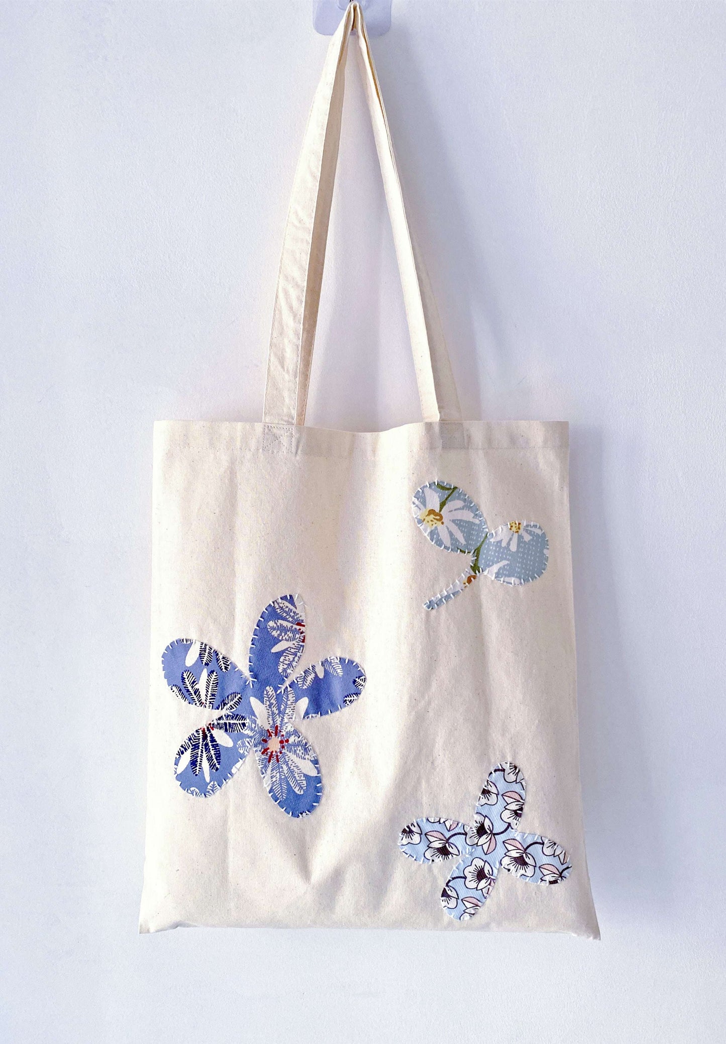 everyday tote with stitched patch details that make each bag look slightly unique