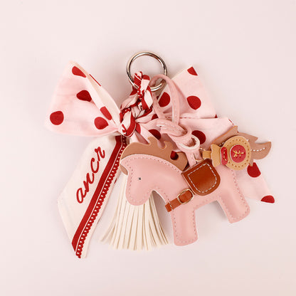 Close-up of the pink polka dot scarf bow