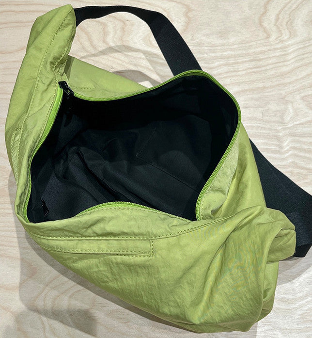 Black fabric shoulder purse with smooth gliding zipper pull