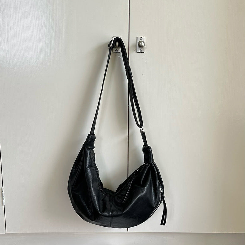 Large sling handbag for relaxed outdoor activities.