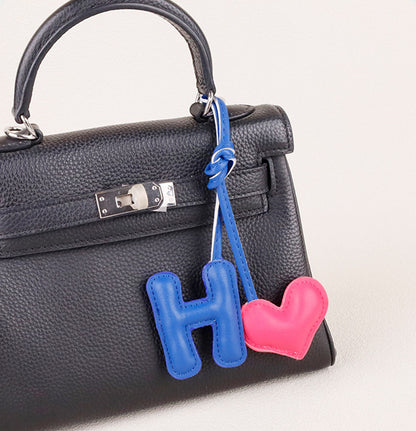 Soft padded heart pendant with letter decoration
