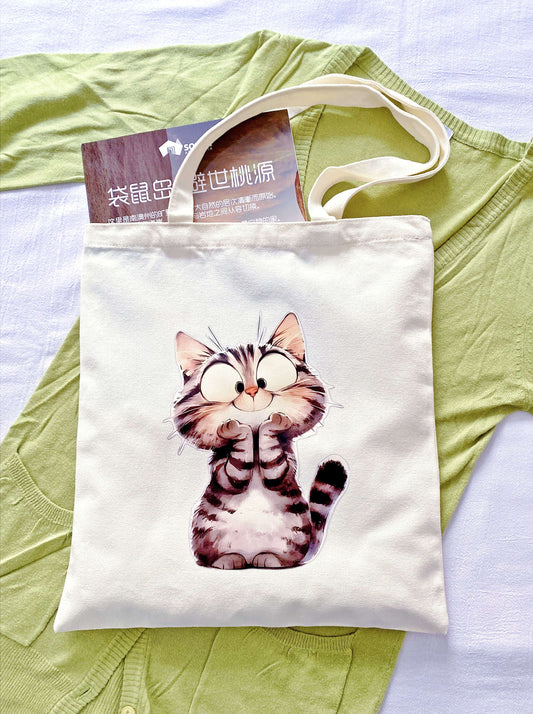 Reusable earth-friendly shopping bag showcasing an original hand-printed kitten design for conscious consumers.
