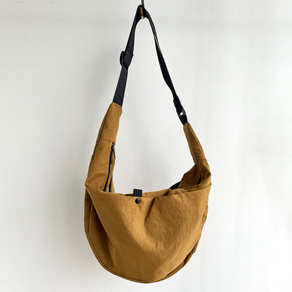 Utility crescent crossbody bag for museum visits and sight seeing