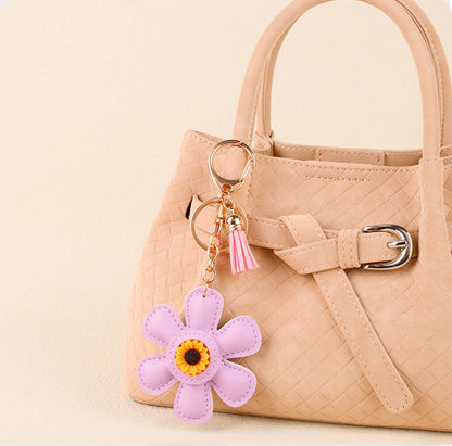 Yellow sunflower tassel detail on a casual tote bag