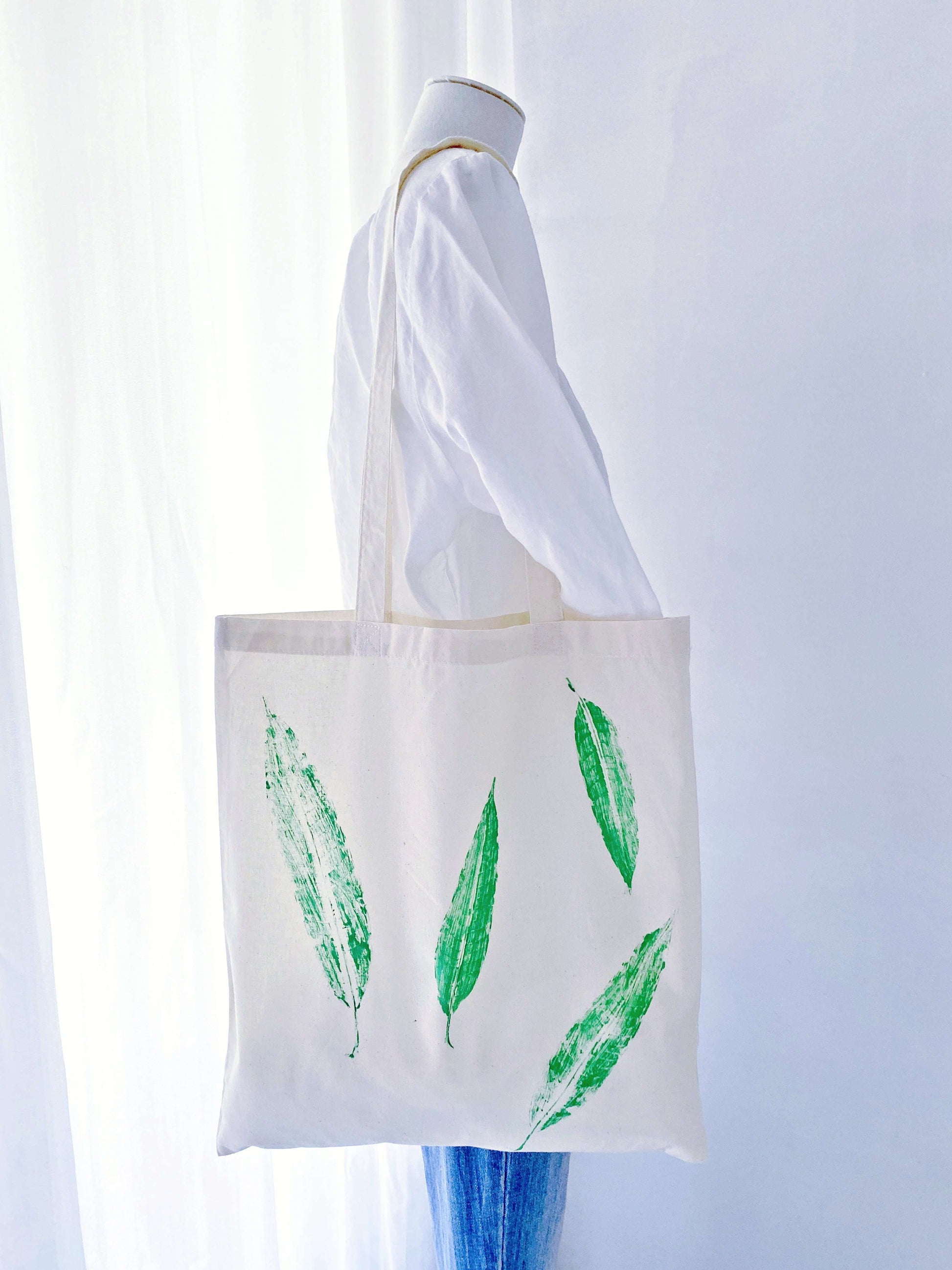 Gift a touch of nature with this hand-printed cotton tote bag, featuring a calming leaf design perfect for any occasion.