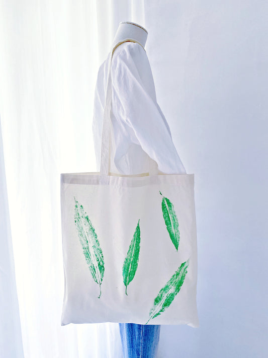 Gift a touch of nature with this hand-printed cotton tote bag, featuring a calming leaf design perfect for any occasion.